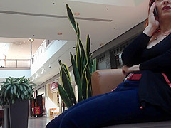Mature woman sitting on mall bench