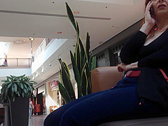 Mature woman sitting on mall bench