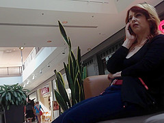 Mature woman sitting on mall bench