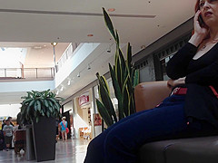 Mature woman sitting on mall bench
