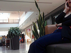 Mature woman sitting on mall bench