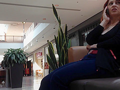 Mature woman sitting on mall bench