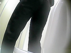 Mature woman squats over toilet to piss