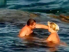 NUDIST COUPLES ON BEACH