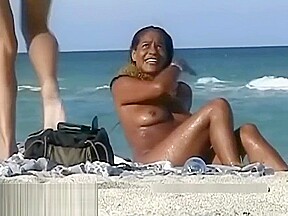 Naked hotties followed around by a nude beach