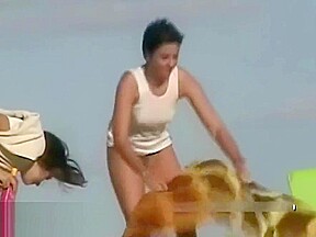 Naked hotties followed around by a nude beach