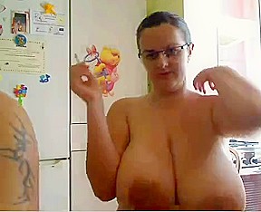 Nerdy slut shows her big round tits on veb chat