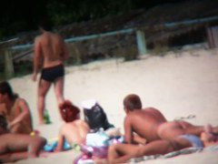 Nudist beach shoots naked babes sunbathing