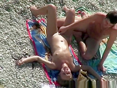 Nudist pussy fingering in beach