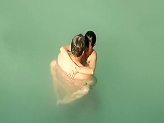Nudist sex in the water