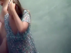 Nudist woman brushing her teeth