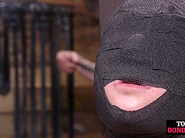 Obedient BDSM masked babe gets whipped by CMNF master