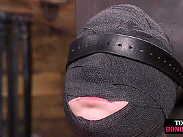 Obedient BDSM masked babe gets whipped by CMNF master