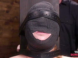 Obedient BDSM masked babe gets whipped by CMNF master