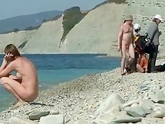 Outdoor shot of nude babe on beach