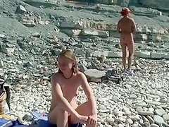 Outdoor shot of nude babe on beach