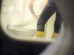 Peeping her through a public toilet hole