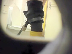 Peeping her through a public toilet hole