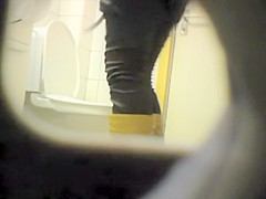 Peeping her through a public toilet hole