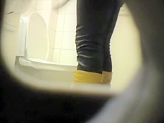 Peeping her through a public toilet hole