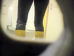 Peeping her through a public toilet hole