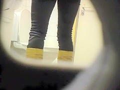 Peeping her through a public toilet hole
