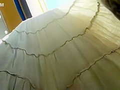 Peeping on her buttocks under a skirt