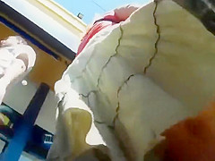 Peeping on her buttocks under a skirt