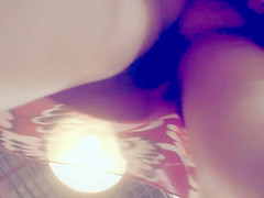 Peeping under a short jeans skirt