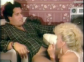 Porn Star Amber Lynn gives a guy a blowjob
