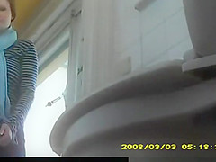 Redhead teen 18+ spied in public toilet pissing
