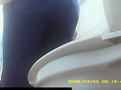 Redhead teen 18+ spied in public toilet pissing
