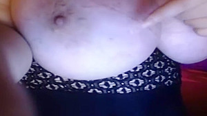 Seductive busty huzzy is fingering her twat