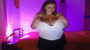 Seductive busty huzzy is fingering her twat