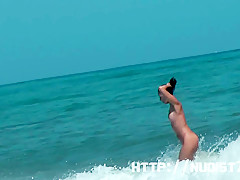 Sexy beach nudist girls get their hot booties admired