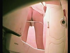 Slim girl in thong pissing was shot on the