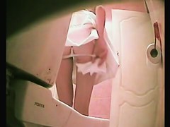 Slim girl in thong pissing was shot on the