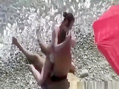 Small breasts woman fucked in rocky beach