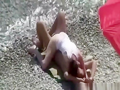 Small breasts woman fucked in rocky beach