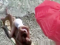 Small breasts woman fucked in rocky beach