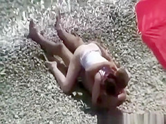 Small breasts woman fucked in rocky beach