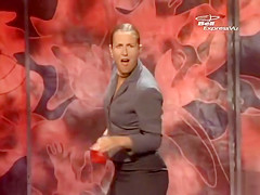 Stripping magic act on stage at a festival