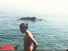 Stunning tanned babes are all over that nudist beach