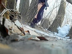 Taking a pee outdoors in a cold winter day