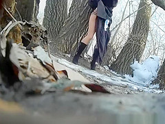 Taking a pee outdoors in a cold winter day