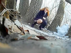 Taking a pee outdoors in a cold winter day