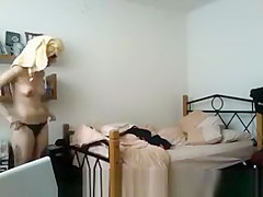 Tattoed girl in bedroom after shower