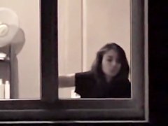 The window of my neighbor is opened showing her nude boobs