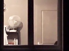 The window of my neighbor is opened showing her nude boobs