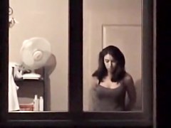 The window of my neighbor is opened showing her nude boobs